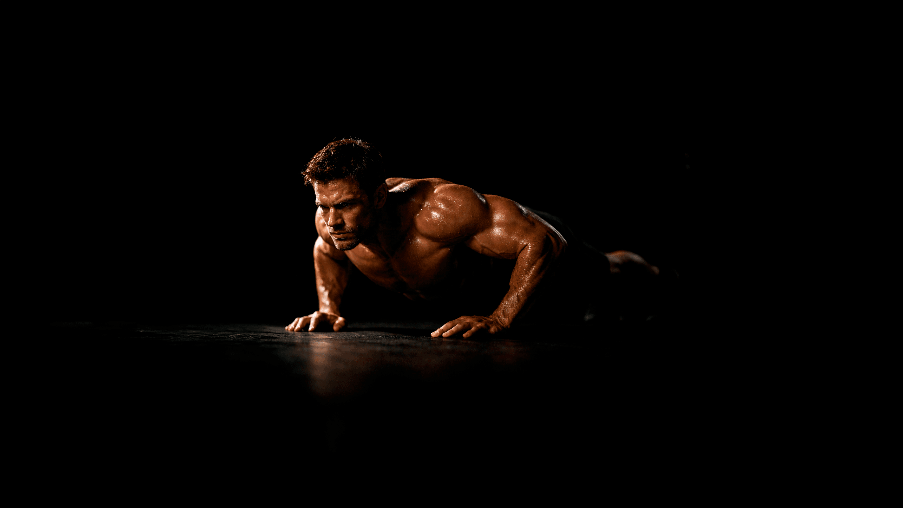 Atleta em posicao de flexao